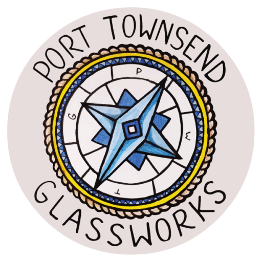 A round logo with the words port townsend glassworks in it.