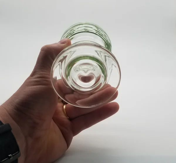 A person holding a glass in their hand.
